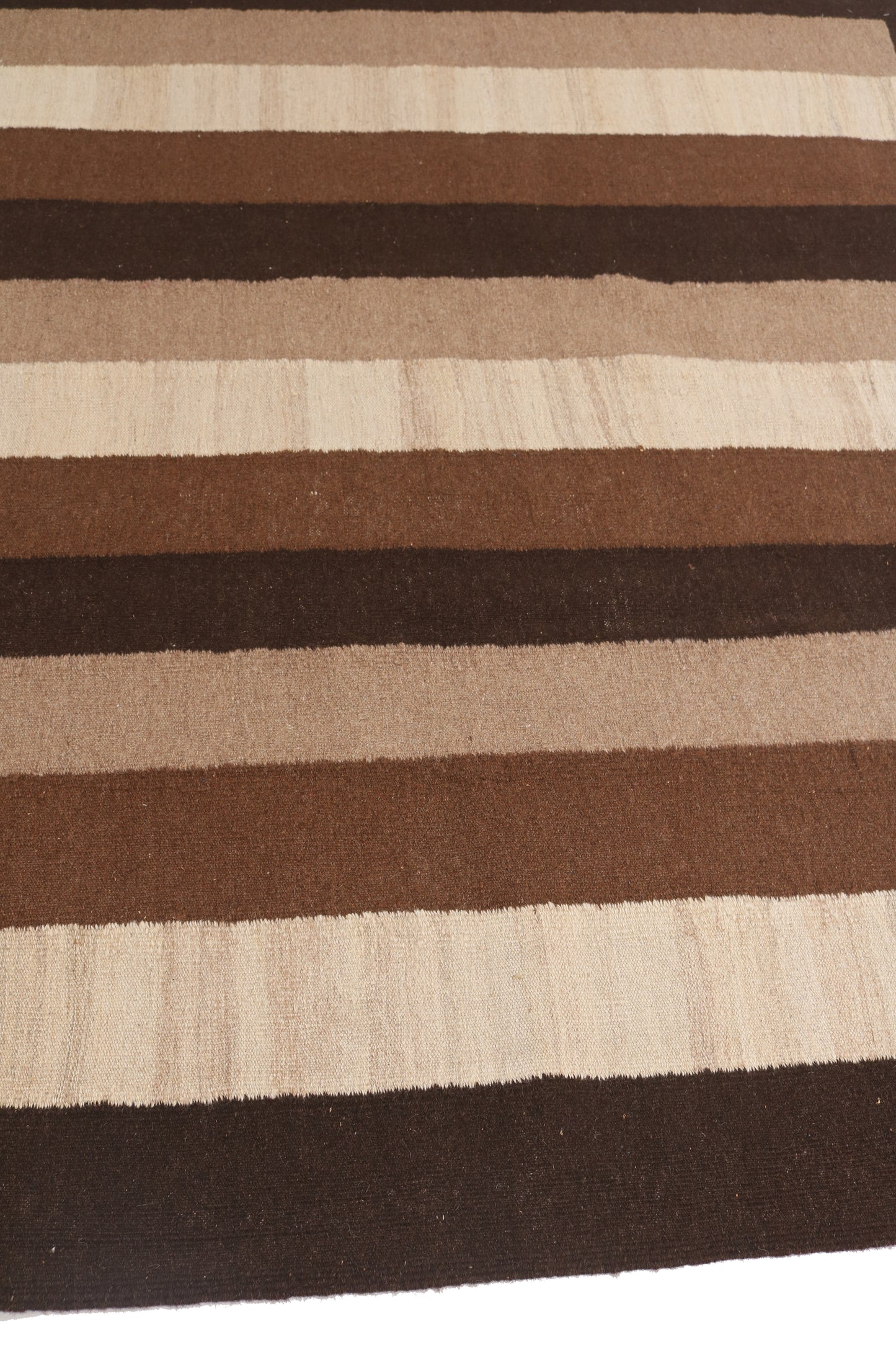 Striped rug with brown and beige horizontal stripes on a white background