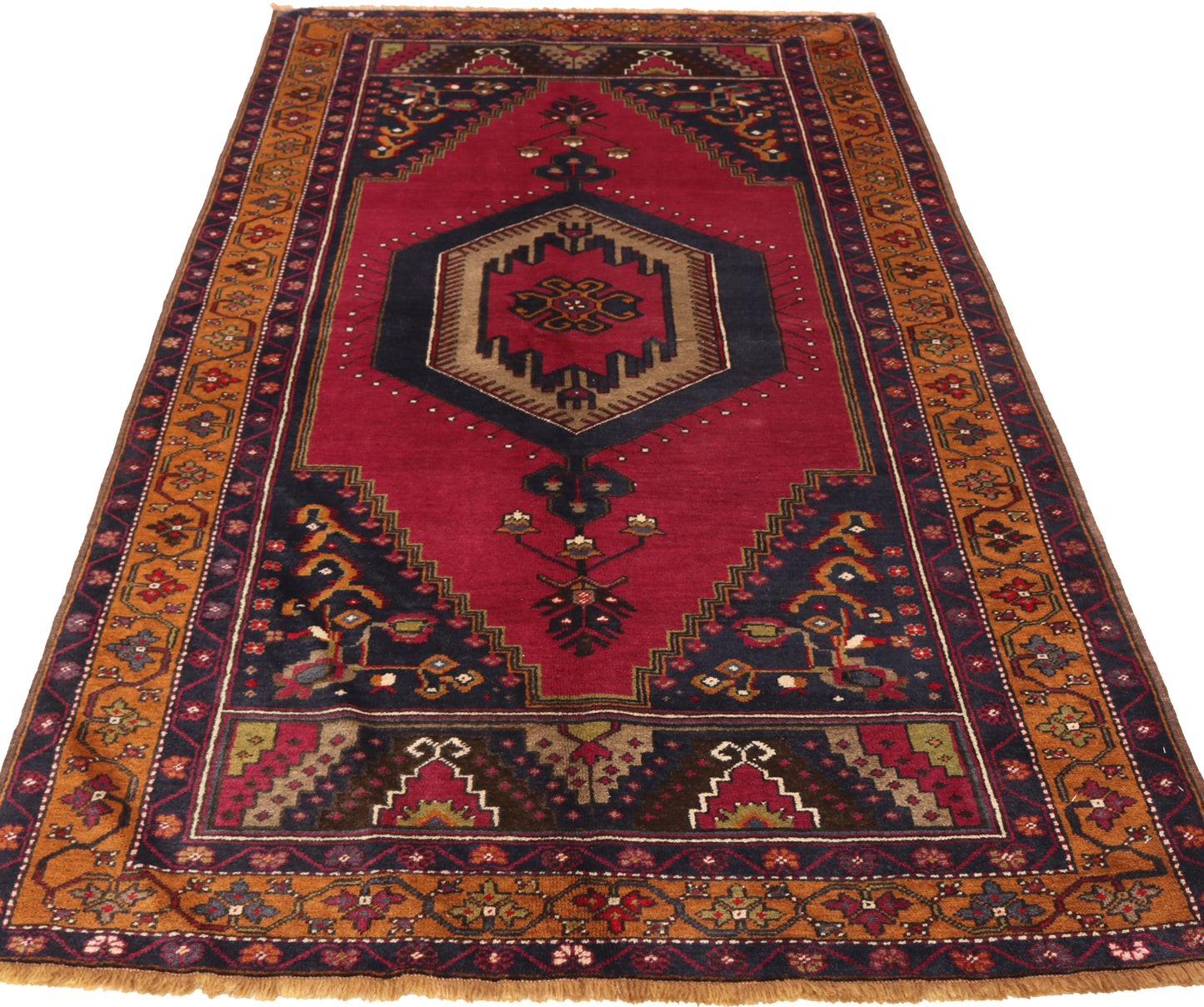 8x4ft antique traditional runner rug for hire, showing the saturated red field and historic geometric patterns suitable for event walkways and film sets.