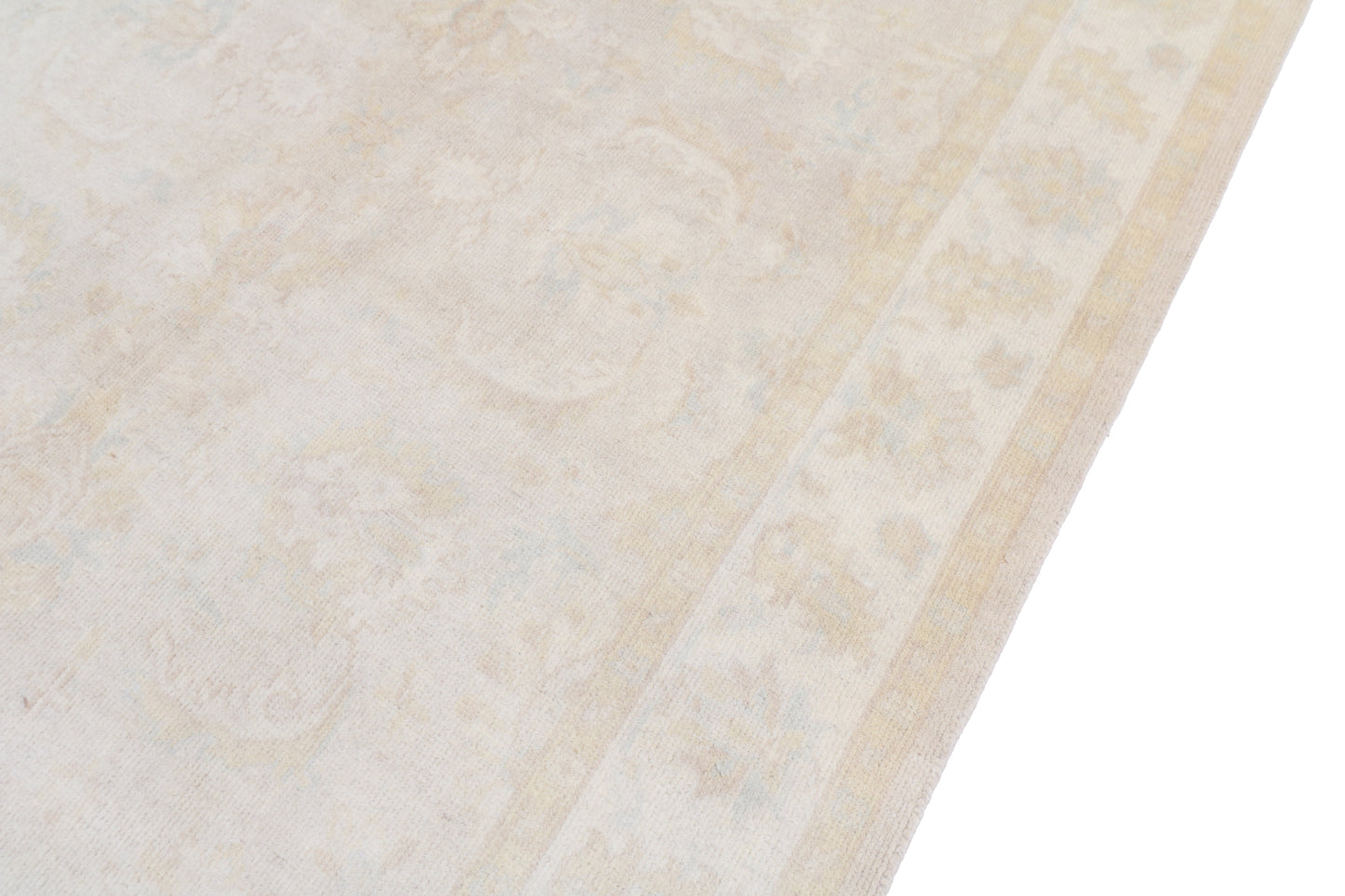 Close-up of a textured beige rug surface