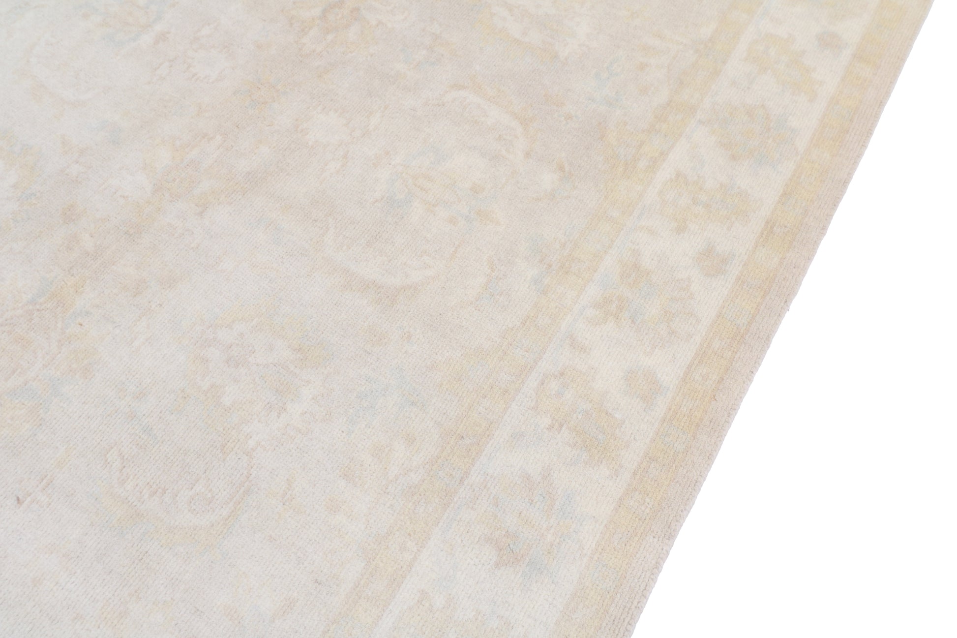 Close-up of a textured beige rug surface