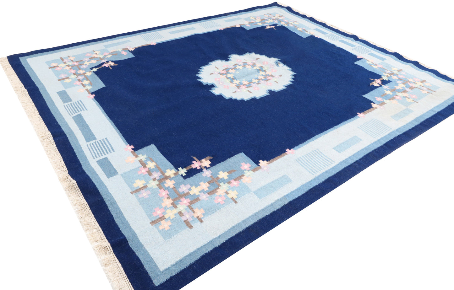Decorative rug with blue and white pattern on a white background