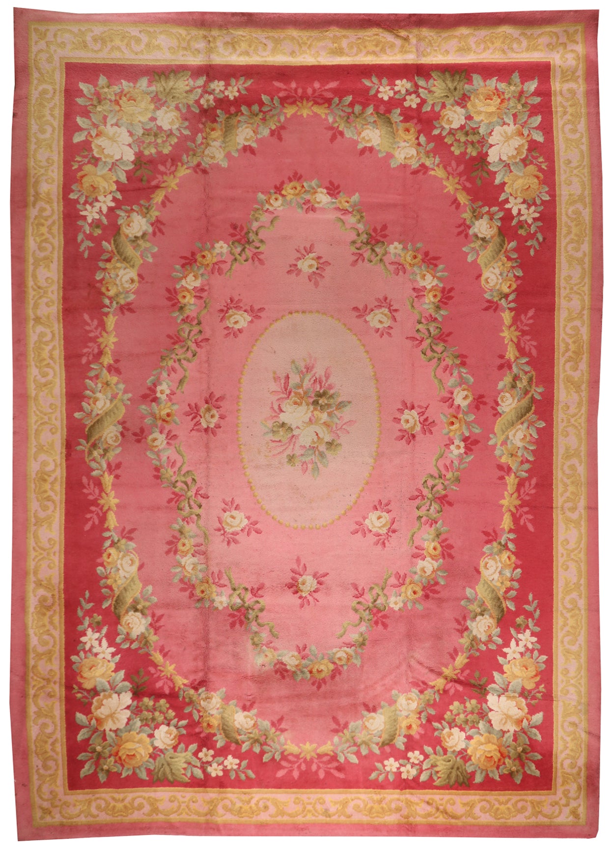Oversized French Savonnerie style hand-knotted wool rug with a grand floral garland design in ruby, pink, and beige, 550x388cm for 5-day event hire.