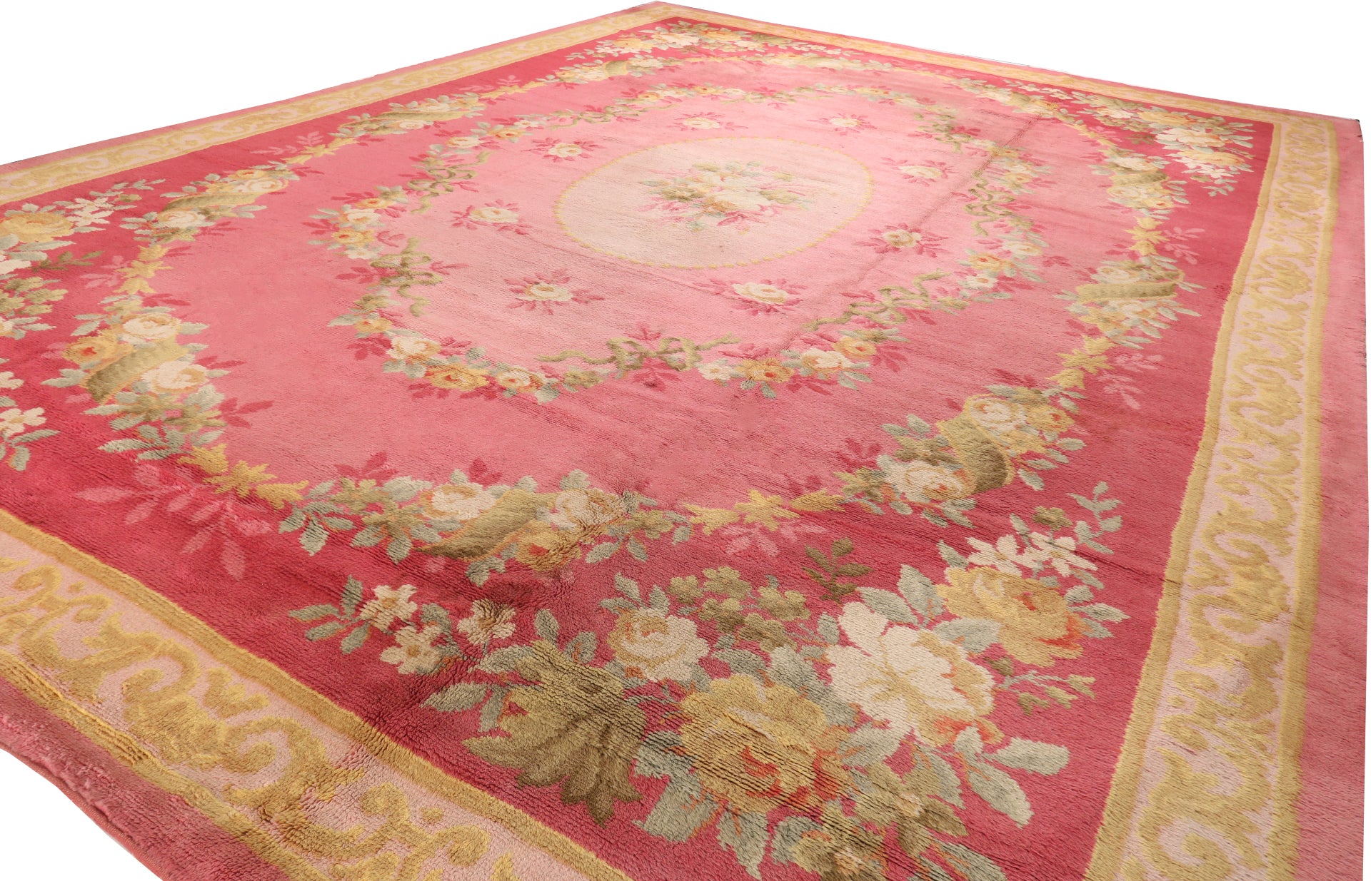 Large 18ft palatial French style rug for hire, showing the expansive pink and ruby floral pattern suitable for grand ballrooms and film production sets.