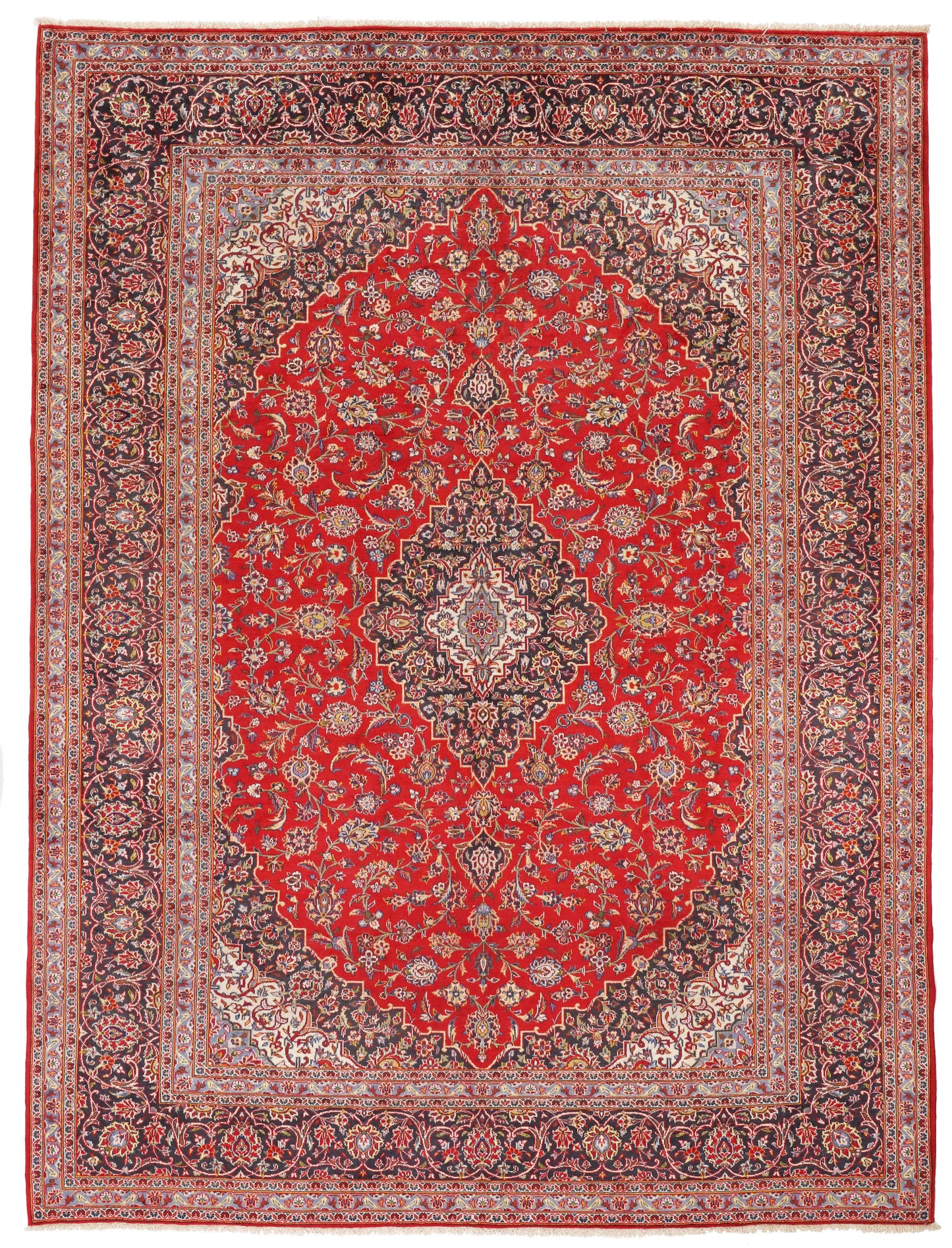 Full-view oversized Persian red and navy rug for hire, 404x300cm, hand-knotted wool, London film set and event rental