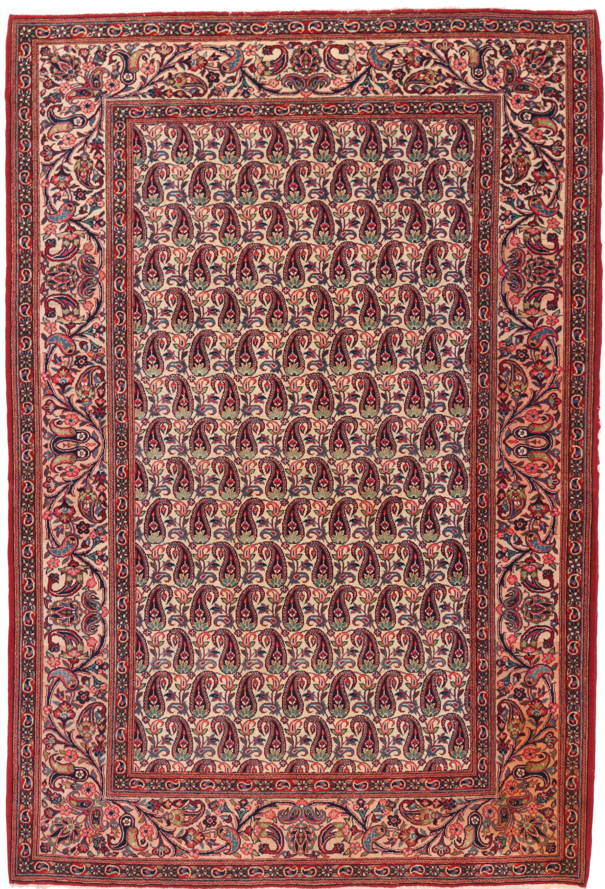 Decorative rug with intricate paisley pattern on a red background