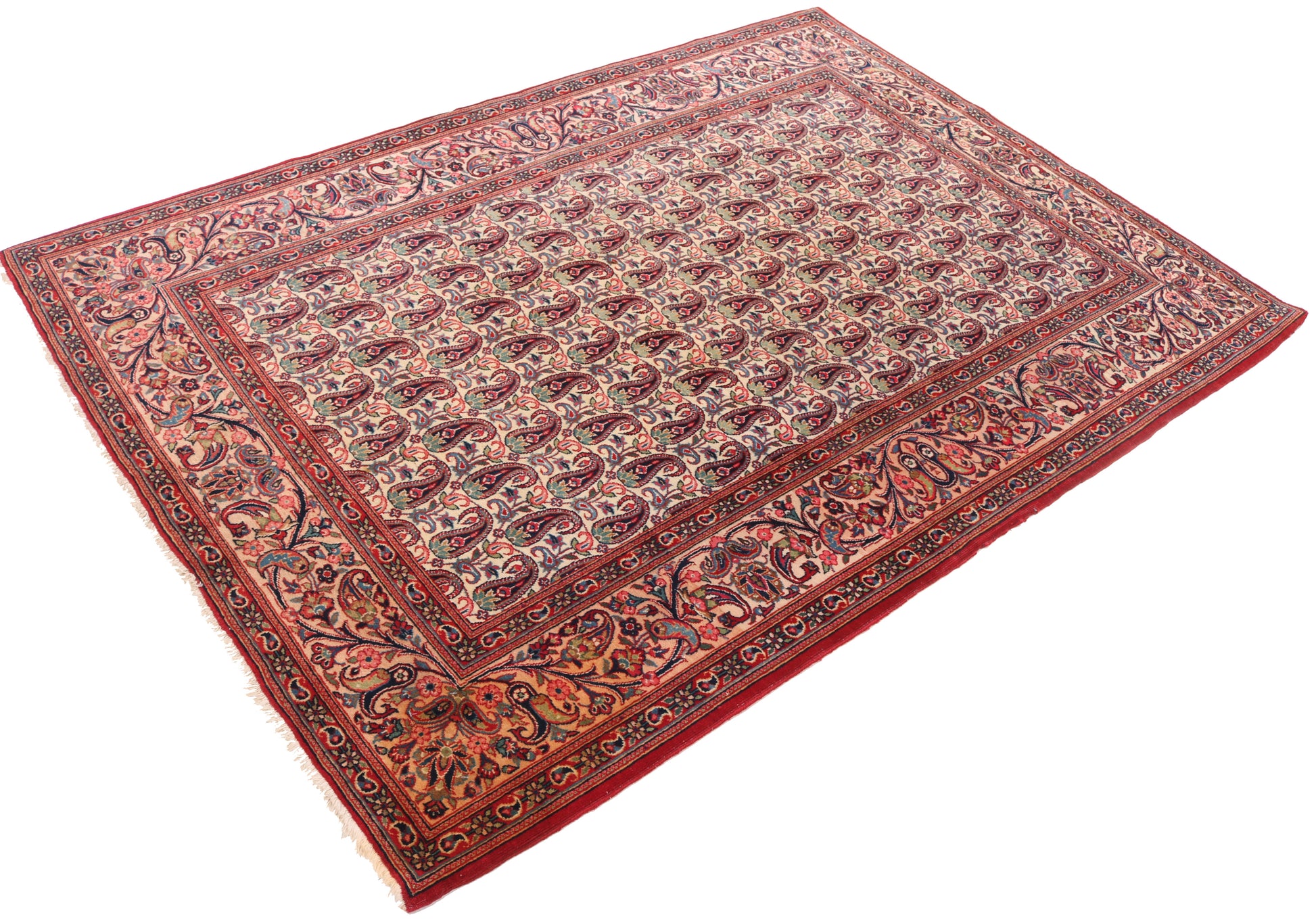 Decorative red and patterned rug on a white background