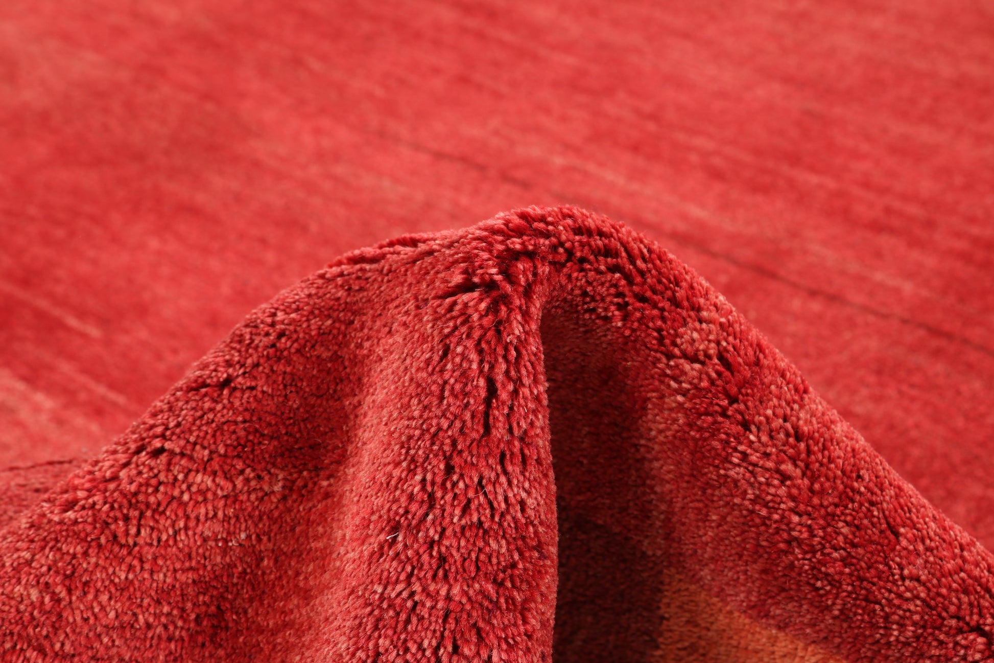 Close-up of red textured rug