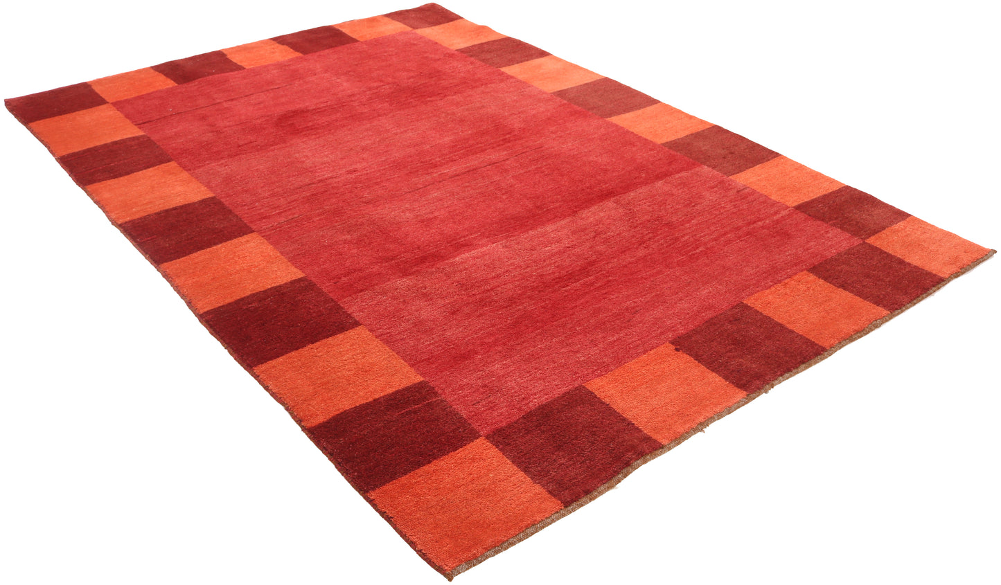 Red and orange checkered rug on a white background