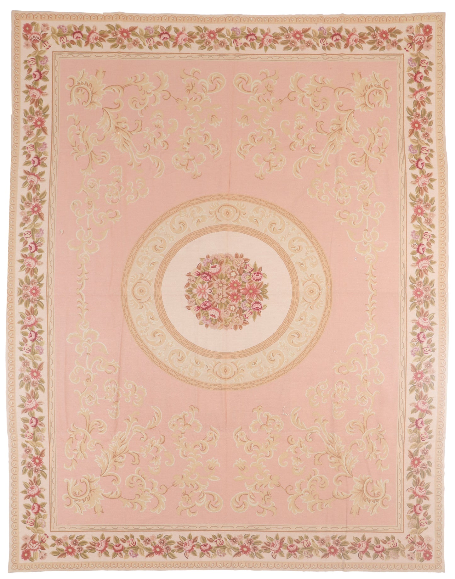 Decorative pink rug with floral patterns and a central medallion