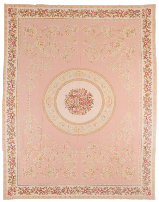 Decorative pink rug with floral patterns and a central medallion