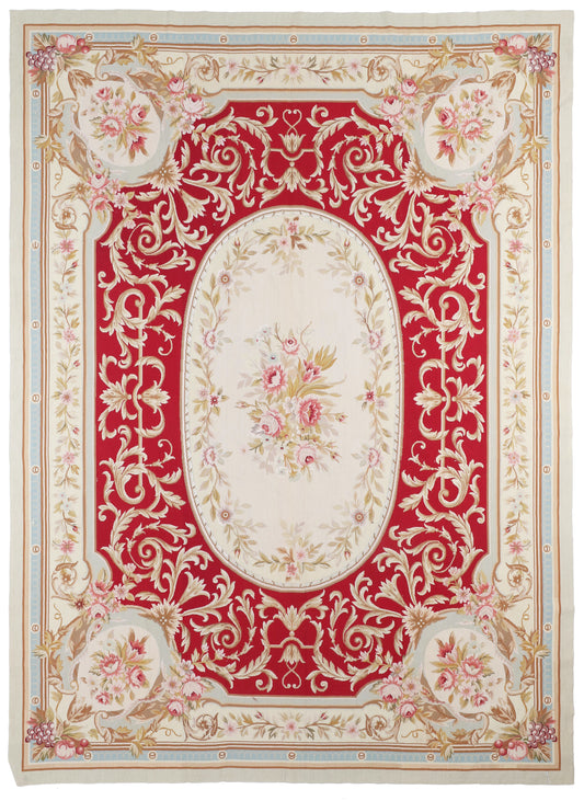 Decorative rug with intricate floral and paisley patterns on a red background