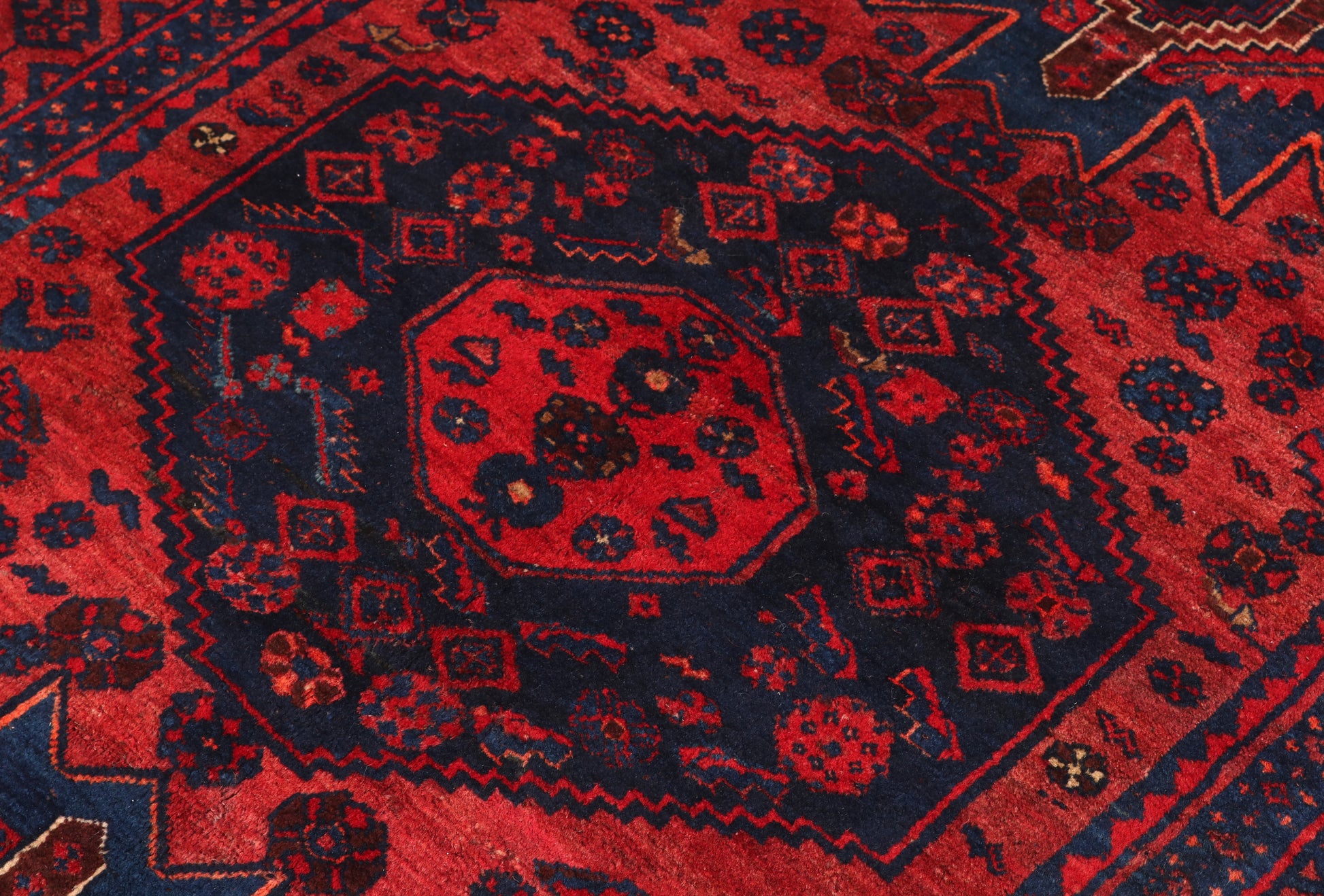 Close-up of a red and black patterned rug