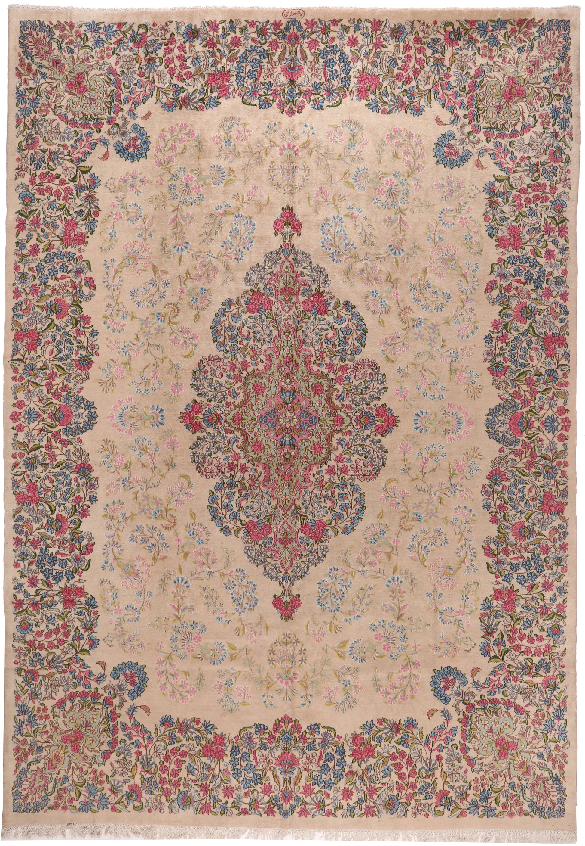 Decorative rug with intricate floral patterns and a central medallion on a beige background.