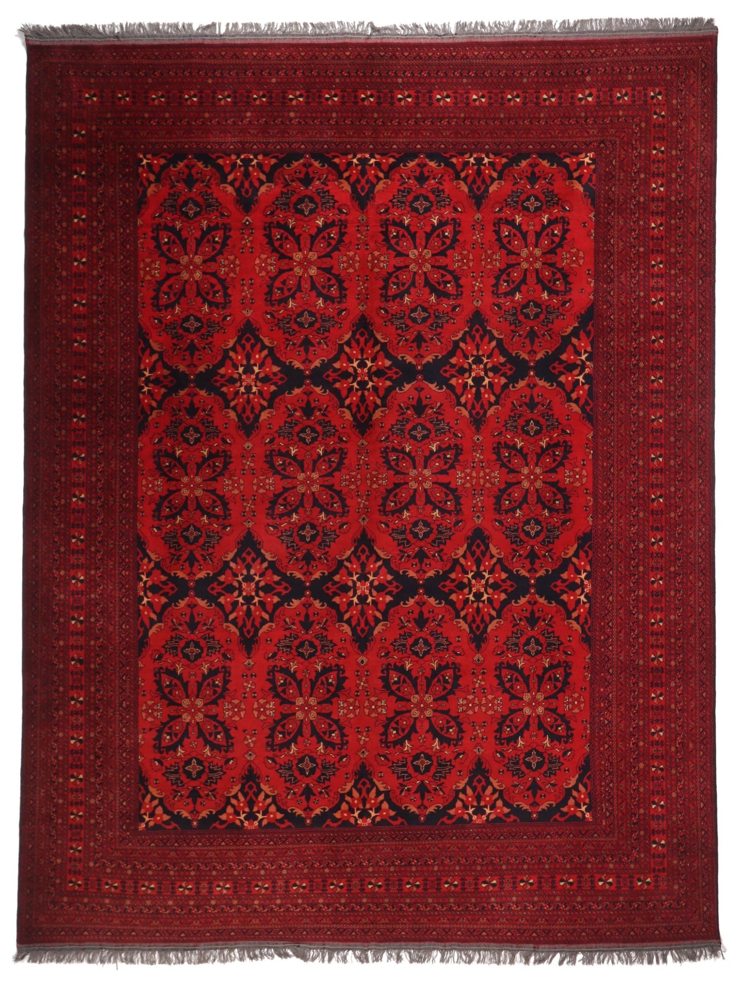 Red patterned rug with intricate designs on a plain background