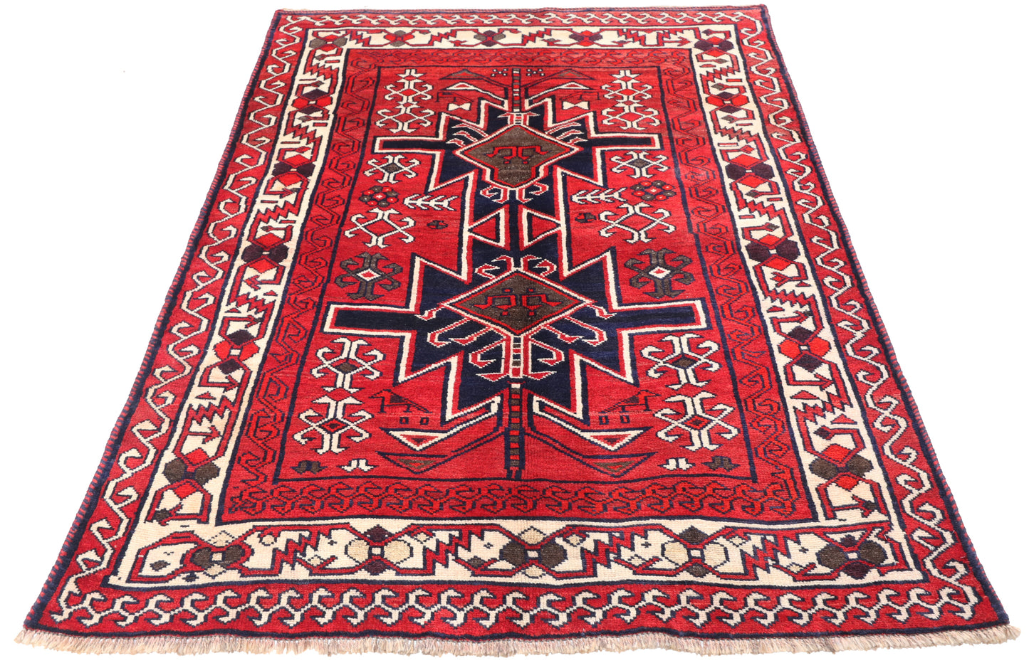 7x5ft traditional red wool rug for hire, showing the sharp geometric patterns and high-contrast border for film and stage sets.