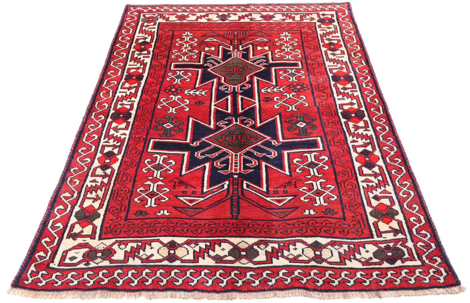 7x5ft traditional red wool rug for hire, showing the sharp geometric patterns and high-contrast border for film and stage sets.