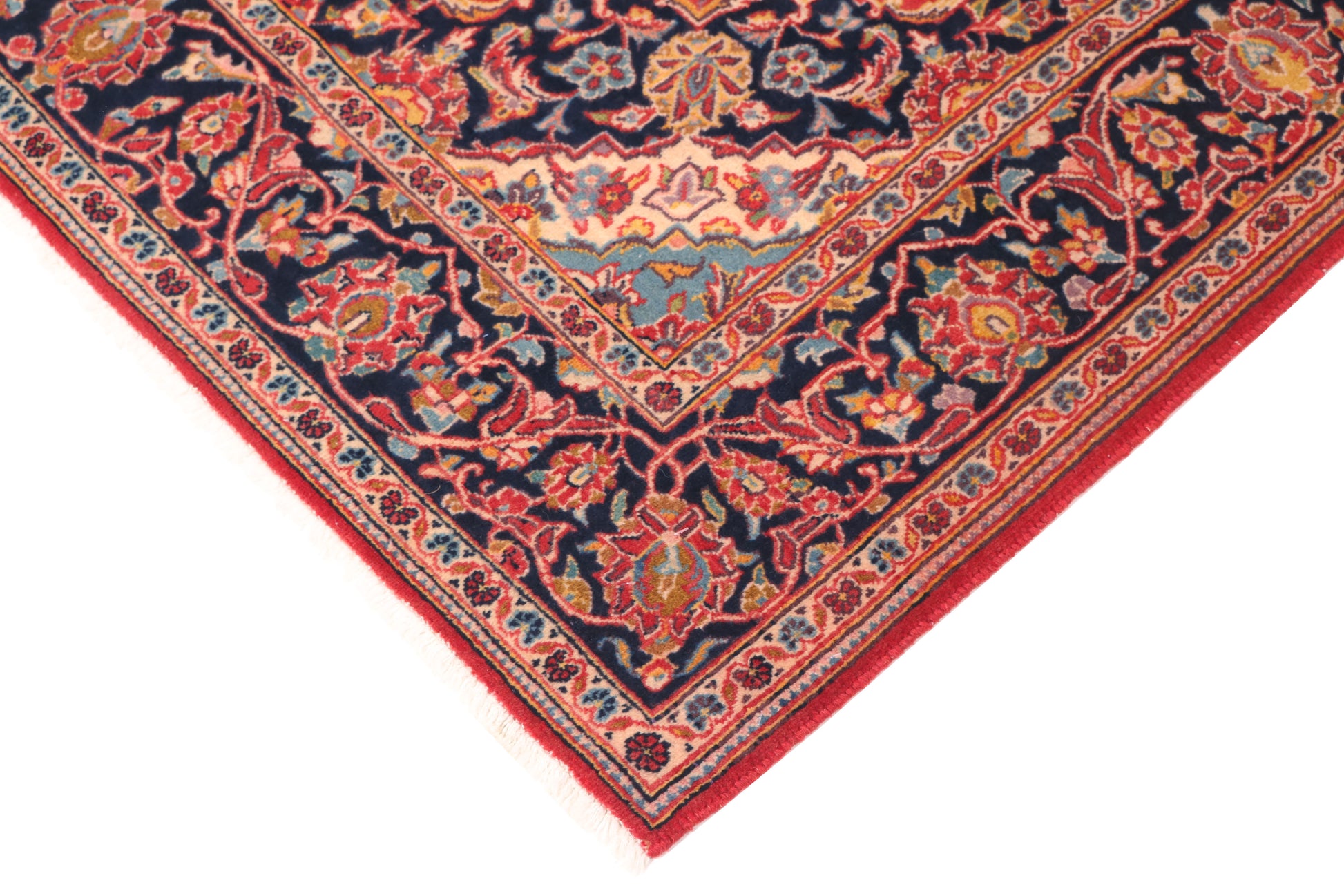 Close-up of a patterned rug with red and blue colors on a white background