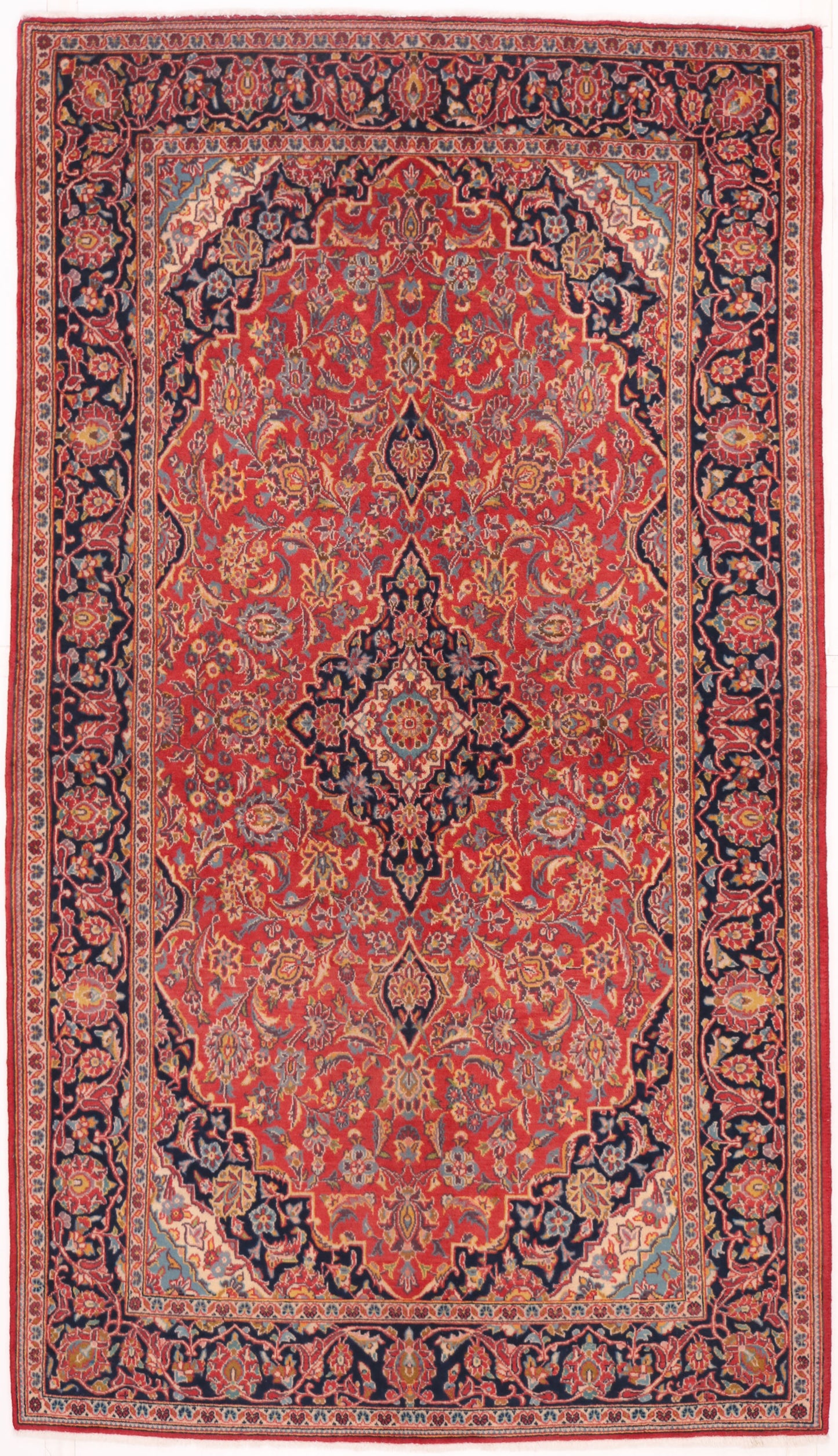 Traditional hand-knotted Persian wool rug in ruby red and navy blue with an intricate floral medallion design, 235x136cm for 5-day event hire.
