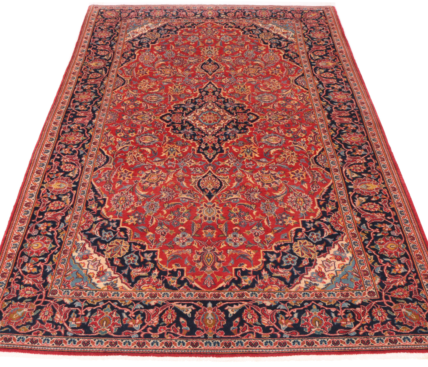 7.7 x 4.4 ft traditional red rug for hire, showing the high-density wool pile and vibrant ruby tones suitable for office sets or exhibition stands.