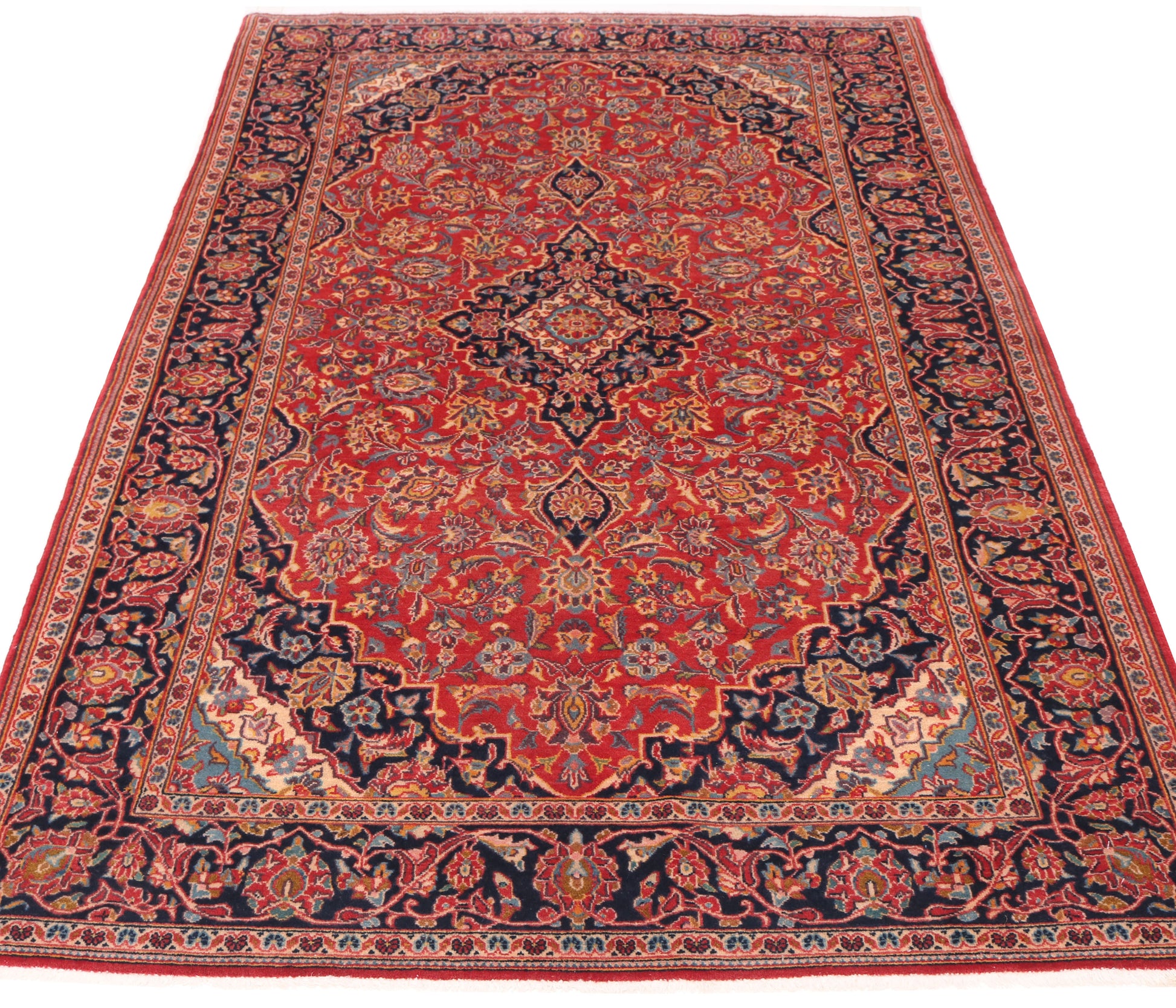 7.7 x 4.4 ft traditional red rug for hire, showing the high-density wool pile and vibrant ruby tones suitable for office sets or exhibition stands.