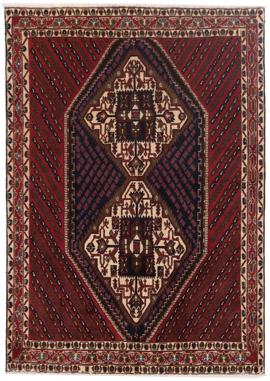 Decorative rug with geometric pattern on a red background