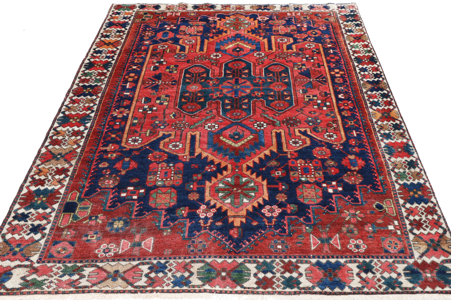 Decorative rug with intricate patterns on a white background