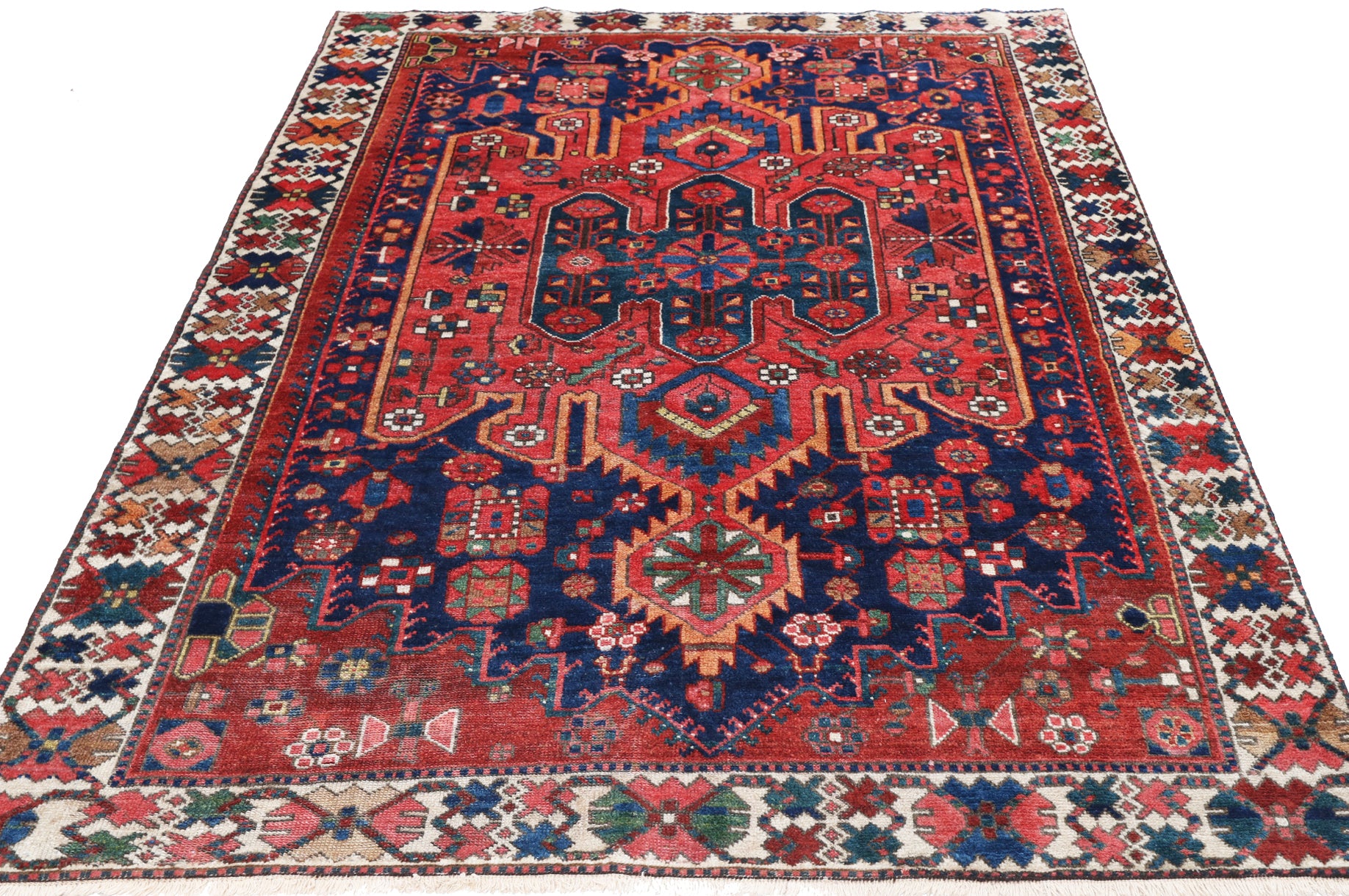 Decorative rug with intricate patterns on a white background